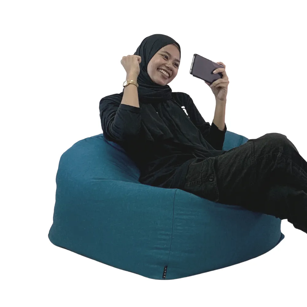 Rey Bean Bag - Dark Grey - 9 - black hijab, blue bean bag chair, smiling woman, black top, black pants, gold watch