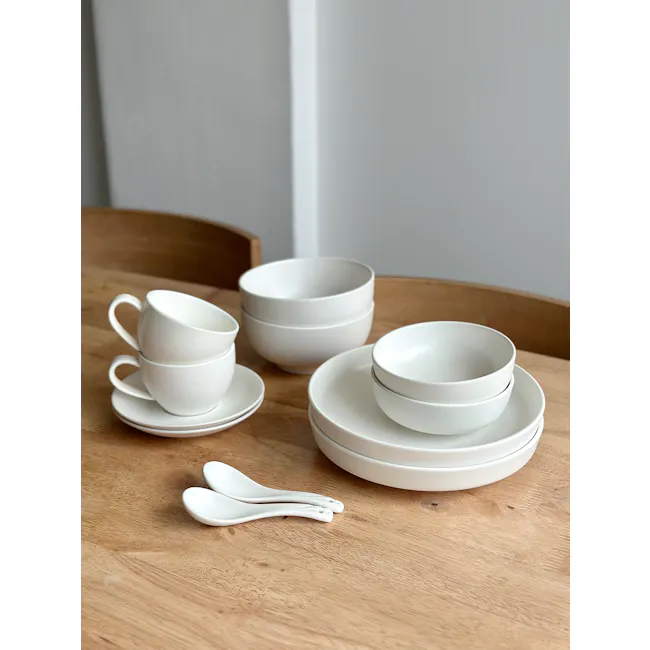 Base Piece Deterra 8.25” Deep Plate - Pearl - 2 - White ceramic teacups and bowls, wooden table, minimalist design, modern