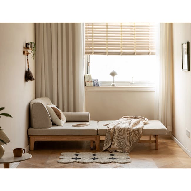 Zara Sofa Bed - Gravel White - 11 - Minimalist living room, cozy seating area, natural light streaming in, beige sofa