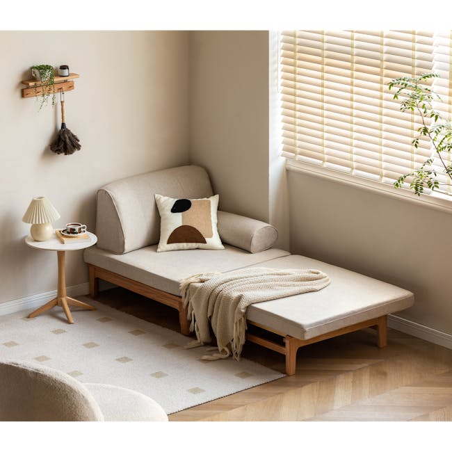 Zara Sofa Bed - Gravel White - 3 - Minimalist living room, cozy seating, beige sofa, wooden side table, white lamp, textured