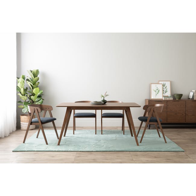 Melda Dining Armchair - Cocoa, Navy - 2 - Modern dining room with wooden furniture, light blue rug, minimalist design