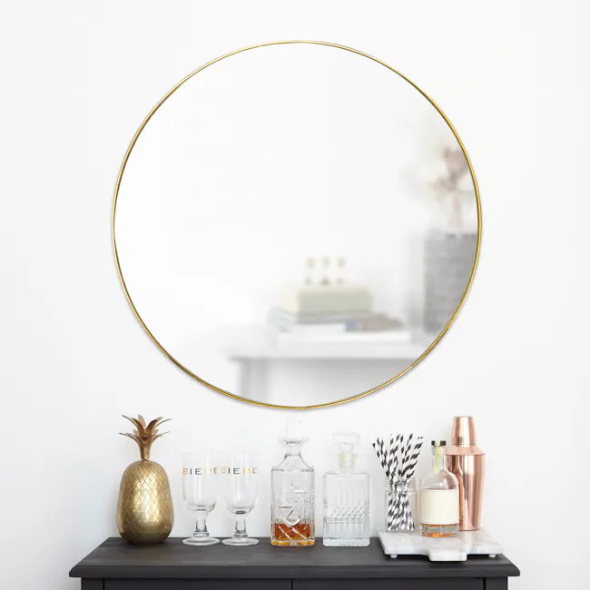 Hubba Round Mirror 86 cm - Brass - 7 - Gold-framed mirror, minimalist decor, gold accents, elegant setup, modern style
