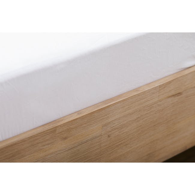 Catania Queen Bed - 12 - White bed sheet, wooden frame, minimalist design, natural wood grain, soft lighting, cozy