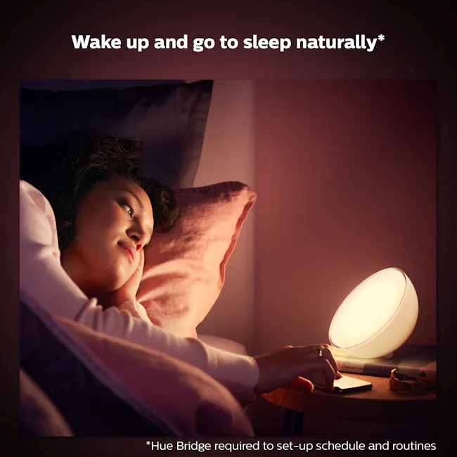 Philips Hue Go V2 - 11 - Sleep, bedtime, natural wake-up, cozy room, soft lighting, person lying, pillow, head resting, warm