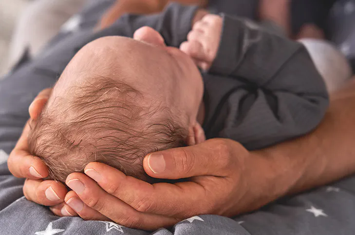 Theraline The Original Maternity and Nursing Pillow - King of the Desert - 13 - Newborn baby, cradled in hands, head resting