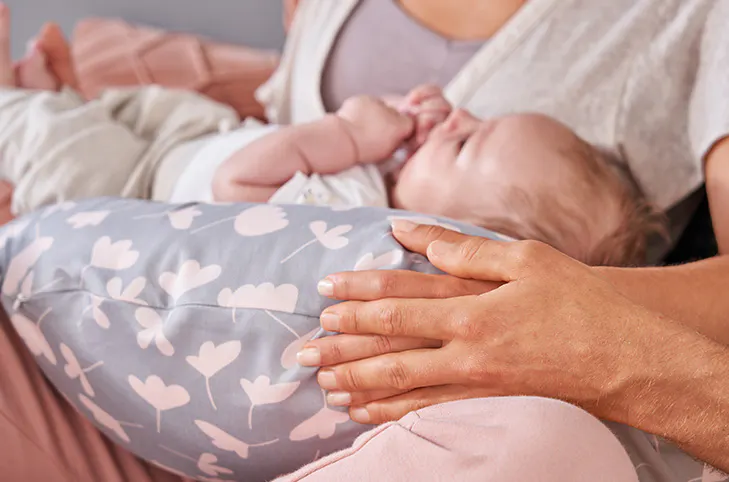 Theraline The Original Maternity and Nursing Pillow - King of the Desert - 11 - Baby, mother, hand, holding, heart-patterned