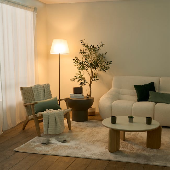 Charli Floor Lamp - White - 4 - Warmly lit room with soft lighting, beige walls, cozy furniture, wooden chair with green