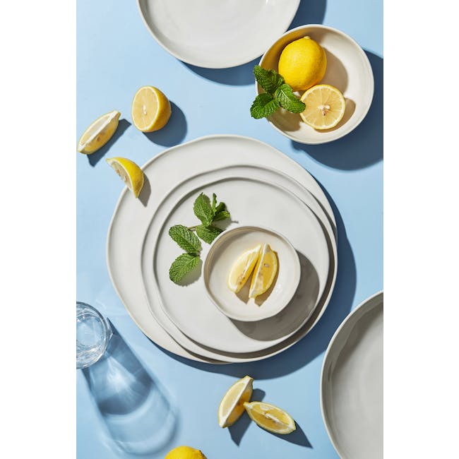 Luzerne Ripple Plate - White Dew (4 Sizes) - 3 - Lemon slices, mint leaves, white plates, blue background, sunlight, clear