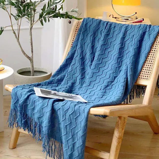 Havre Throw - Blue - 2 - blue textured blanket, cozy chair, wooden chair, natural light, indoor setting, indoor plants