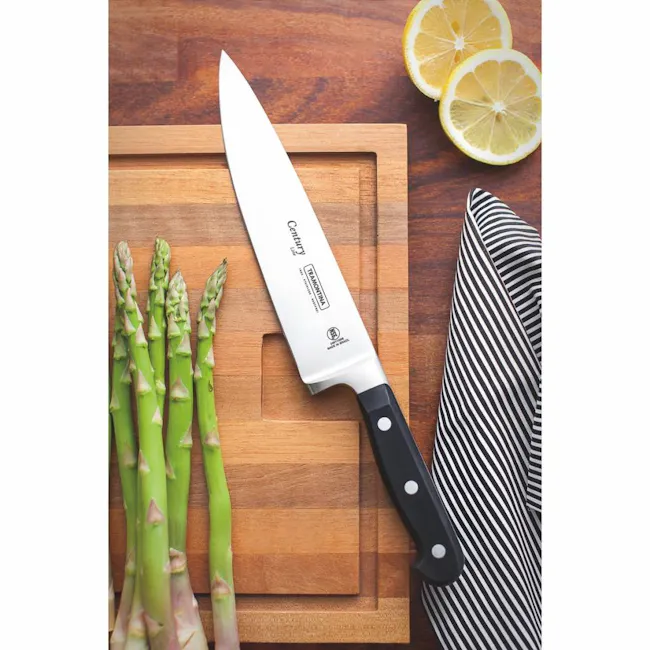 Tramontina Century 8" Chef's Knife - 3 - wooden cutting board, asparagus, knife, citrus slices, black handle, striped knife