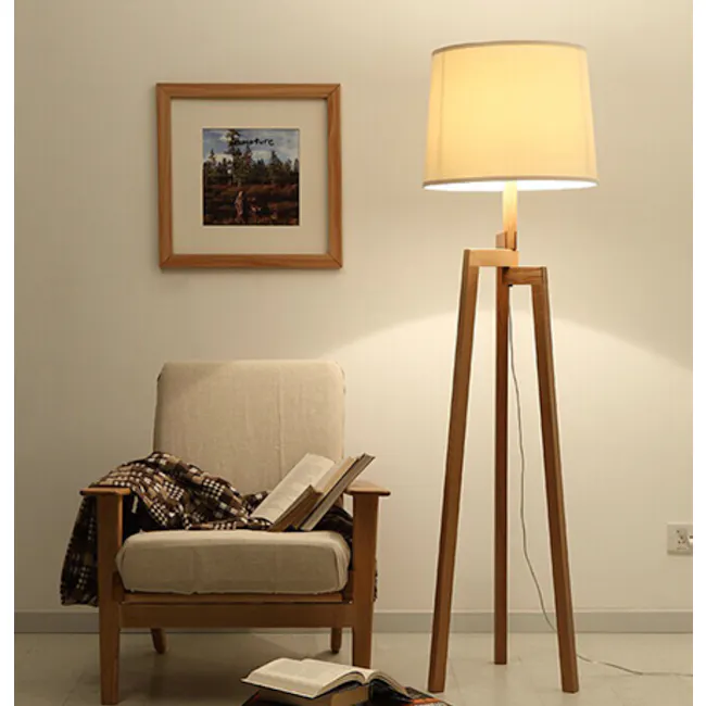 Maya Floor Lamp - Oak, White - 6 - Wooden armchair, beige fabric, plaid blanket, open book, cozy reading nook, soft