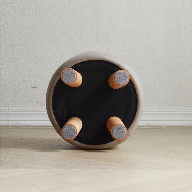 Niyo Stool - Cream - 10 - Round ottoman with four cylindrical wooden handles, beige cushioned interior, black fabric