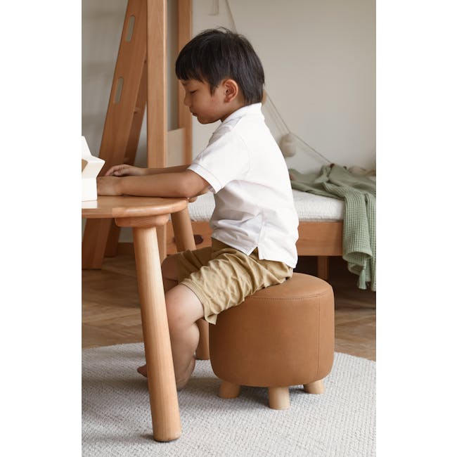Niyo Stool - Cream - 6 - White shirt, brown stool, wooden table, green blanket, beige shorts, wooden chair, wooden stool