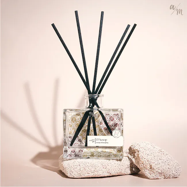 Aroma Matters Reed Diffuser - D'Aesop (2 Sizes) - 2 - glass bottle, black sticks, aromatic arrangement, textured stones
