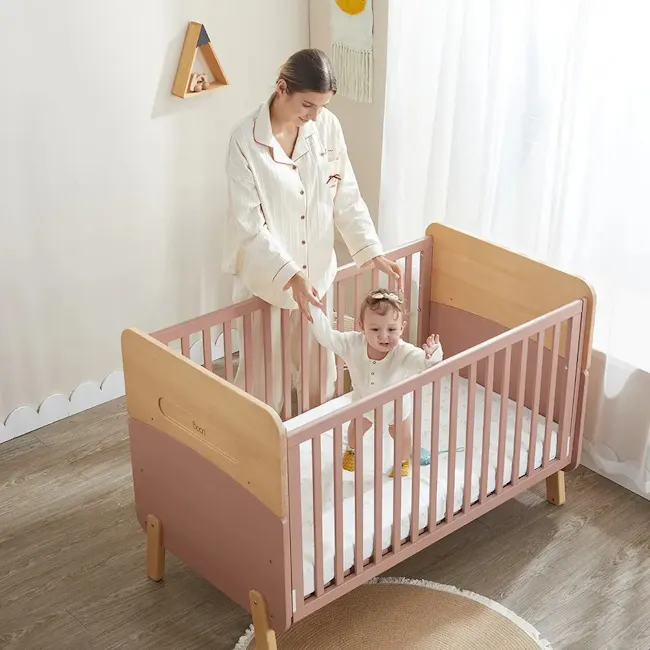 Neat Boori 5 in 1 Cot Bed - Cherry - 4 - White pajamas, baby crib, wooden frame, pink color, wooden legs, baby in crib