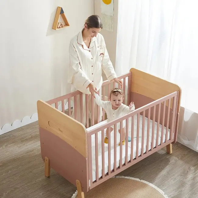 Neat Boori 5 in 1 Cot Bed - Cherry - 4 - White pajamas, baby crib, wooden frame, pink color, wooden legs, baby in crib
