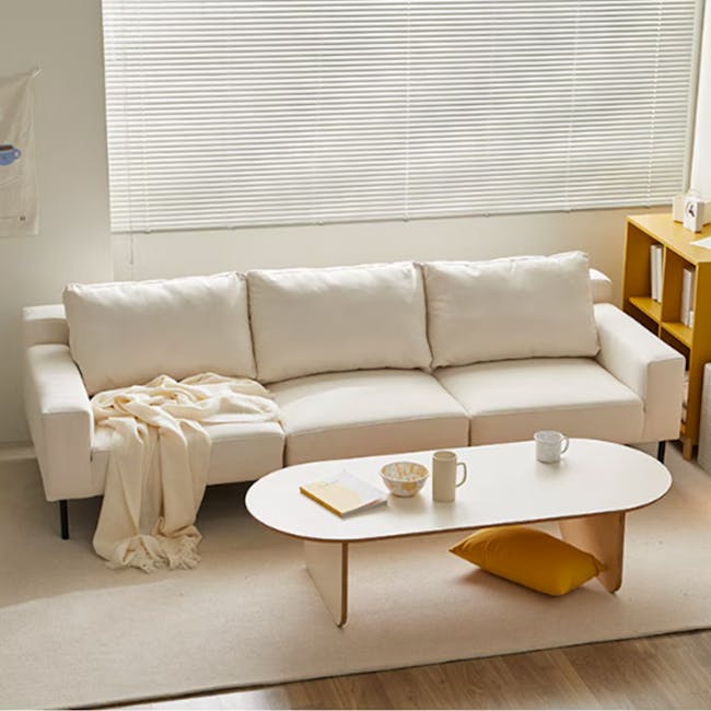 Lusa 3 Seater Sofa - Ivory (Pet Friendly) - 19 - Cream-colored sofa, minimalist decor, white coffee table, soft beige throw