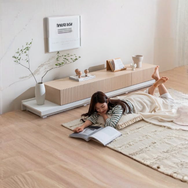 Heidi Extendable TV Console 2.1m-3.1m - Oak - 3 - Minimalist living room, cozy reading nook, woman reading book, modern