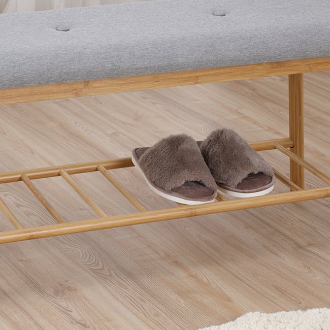 Jassi Shoe Rack Bench 0.9m - 8 - Wooden bench with gray cushion, brown slippers, light wooden frame, light wooden floor