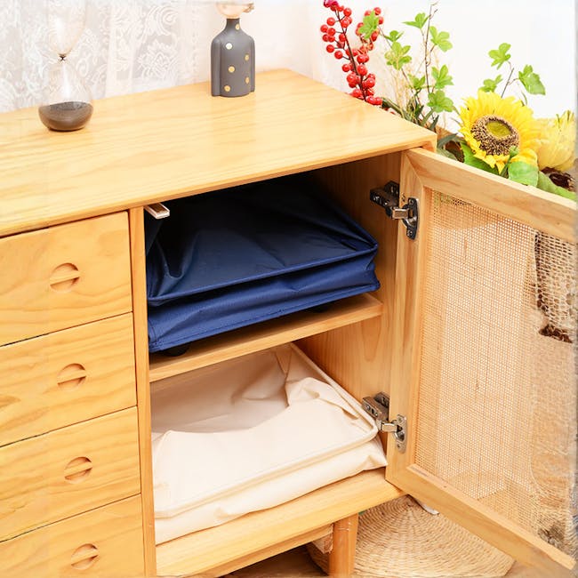 Mason Laundry Hamper with Wheels - Black - 6 - Wooden desk with open drawer, blue fabric neatly folded, white fabric