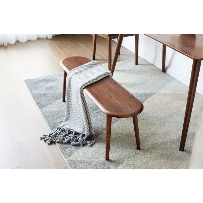 Felda Bench 1m - Walnut - 2 - Wooden bench, gray and white blanket, wooden table, light wooden floor, light gray rug, wooden