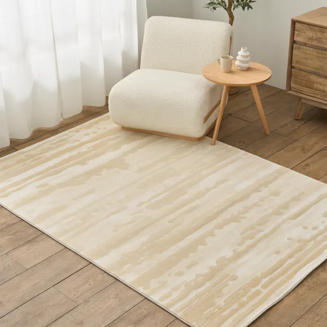 Alana Low Pile Rug - Driftwood (2 Sizes) - 2 - Cream-colored area rug, light wooden floor, natural light, white curtains