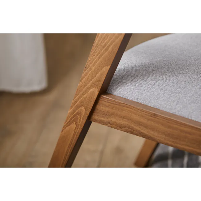 Imogen Dining Chair - Cocoa, Dolphin Grey (Fabric) - 10 - Wooden chair with visible grain, close-up view, natural wood
