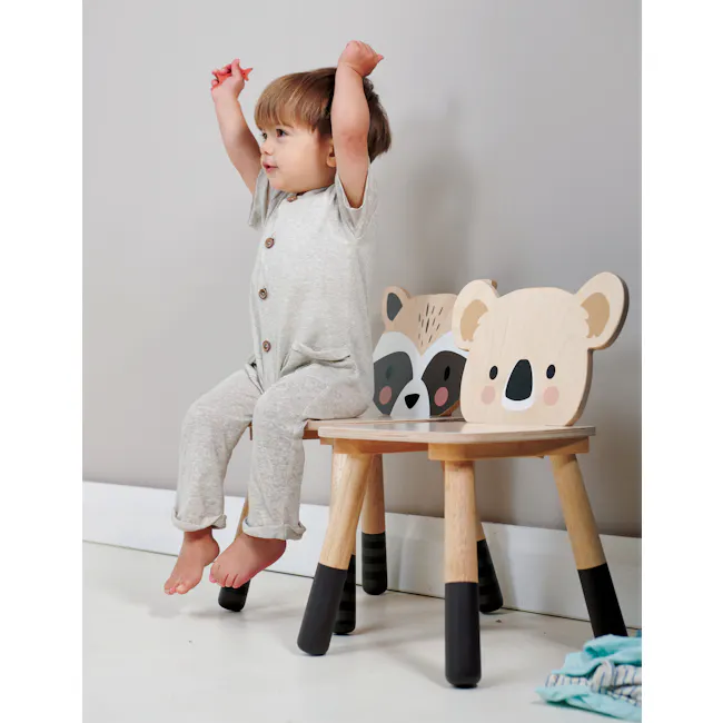 Tender Leaf Forest Chair Set of 2 - Racoon & Deer - 6 - Light gray pajamas, child sitting on wooden stool, arms raised