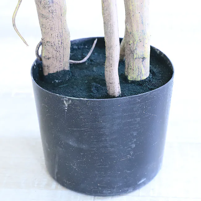 Potted Faux Monstera Plant 90 cm - 5 - Black pot, wooden stakes, small tree, freshly planted, soil, dark green, mulch