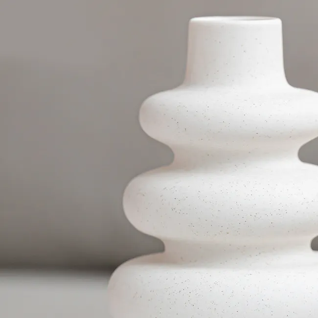 Lenny Ceramic Vase - 4 - White ceramic vase with speckled texture, modern minimalist design, soft focus background, tiered