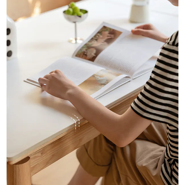 Fidela Extendable Dining Table 0.9m-1.5m (Sintered Stone) - 3 - reading book, open book, person reading, hands holding book
