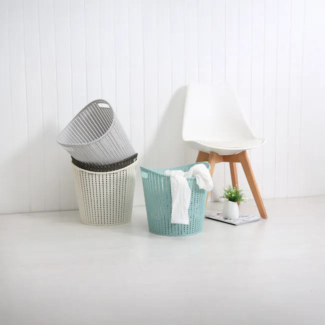 Alice Laundry Basket - White - 3 - White laundry basket, white chair, light wooden floor, white potted plant, newspaper