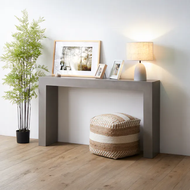 Ryland Concrete Console Table 1.4m - 2 - Modern minimalist decor, light gray desk, wooden floor, potted fern plant, framed