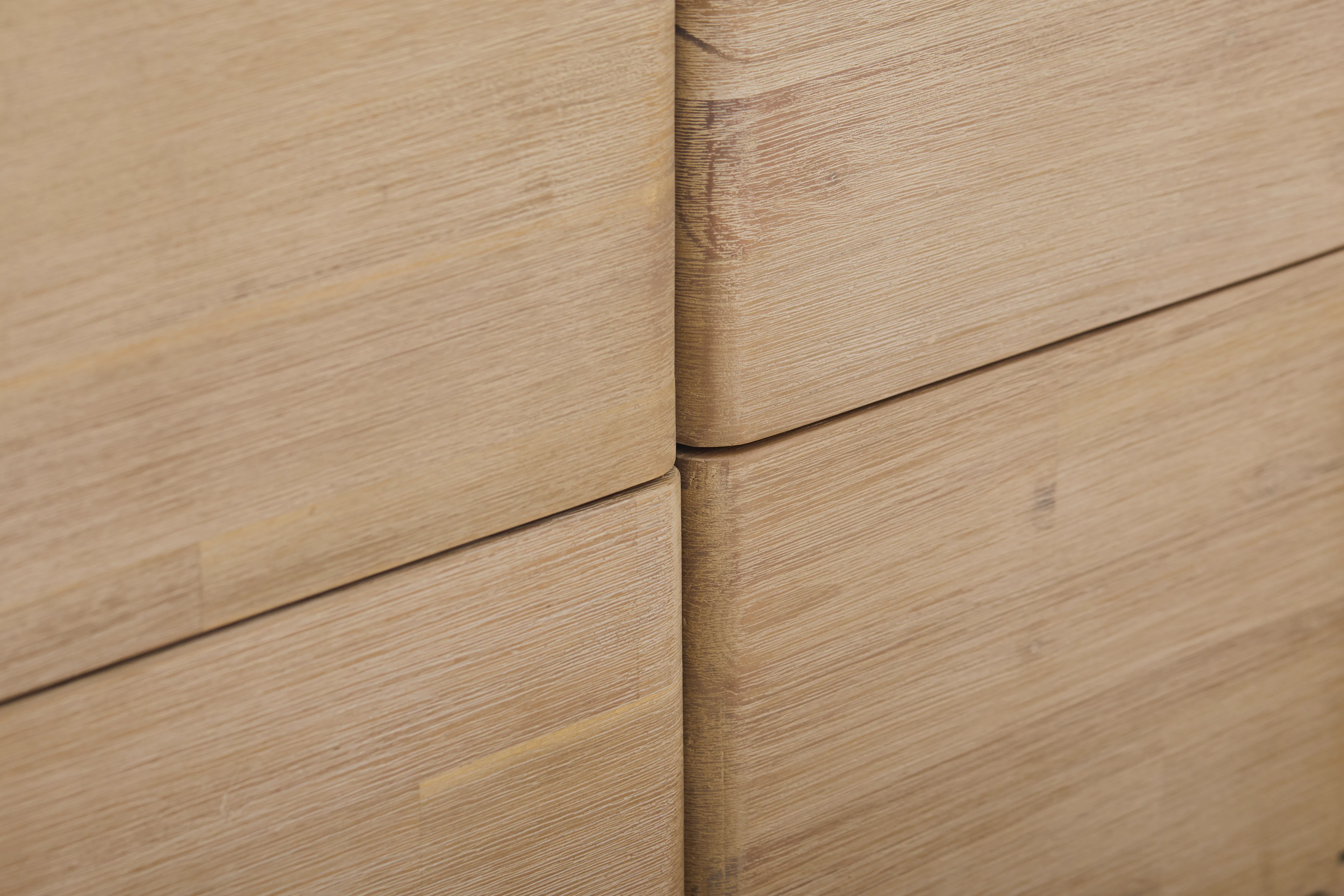 Catania 6 Drawer Chest 1.55m - 17 - Light brown wooden surface, close-up view, textured grain, natural wood color, smooth