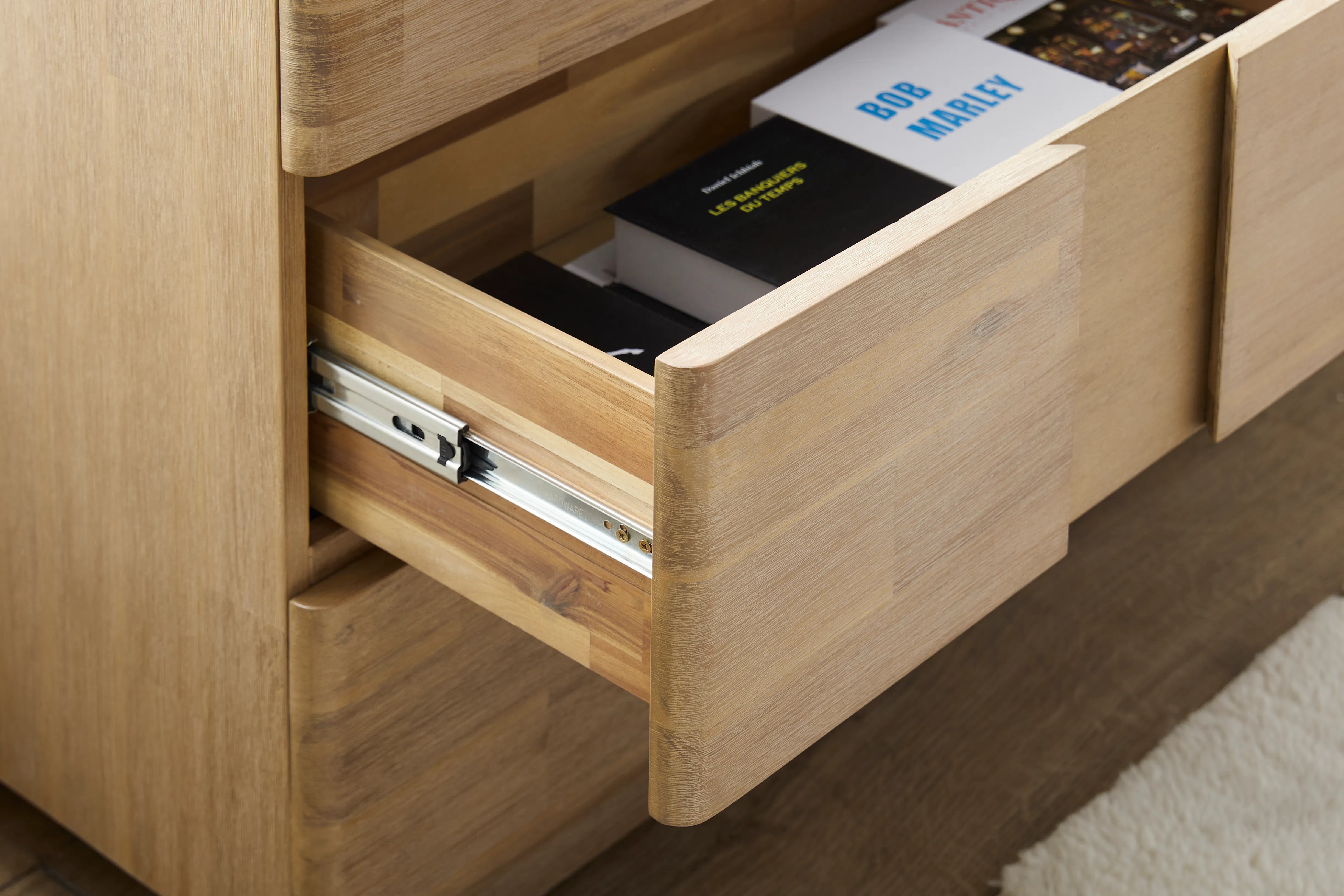 Catania 6 Drawer Chest 1.55m - 14 - Wooden drawer, open drawer, black book, white box, French text, "Les Temps, " "Bob