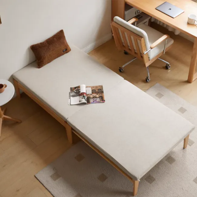 Mariel Lounge Sofa Bed - Gravel White - 6 - Wooden bed with beige cover, brown pillow, small round table with brown cup
