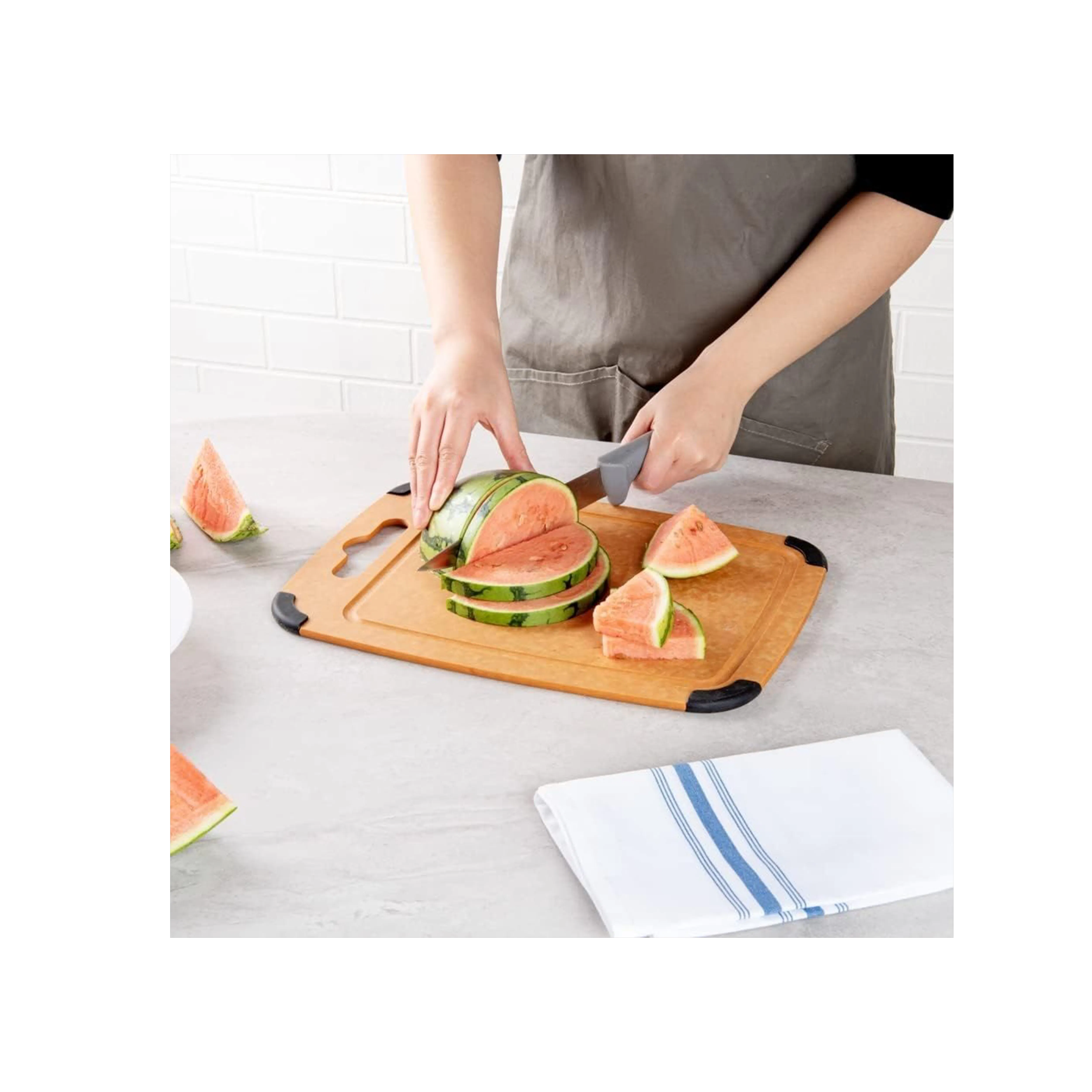 Safico Pro Wood Fibre Cutting Board with Anti-Slip Corners (3 Sizes) - 9 - Watermelon slicing, kitchen countertop, person