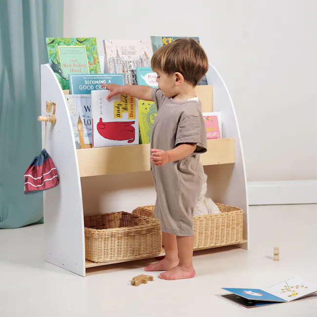 Tender Leaf Forest Bookcase - 7 - Children's bookshelf, child's hand reaching for book, colorful children's books, child's