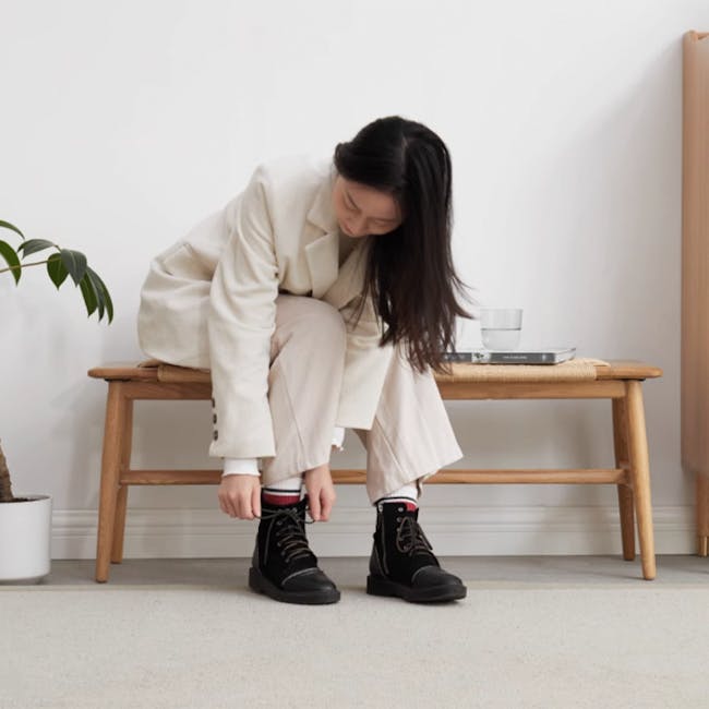 Lucille Bench 1.1m - 8 - Beige blazer, white pants, black boots, red and white socks, wooden bench, indoor setting