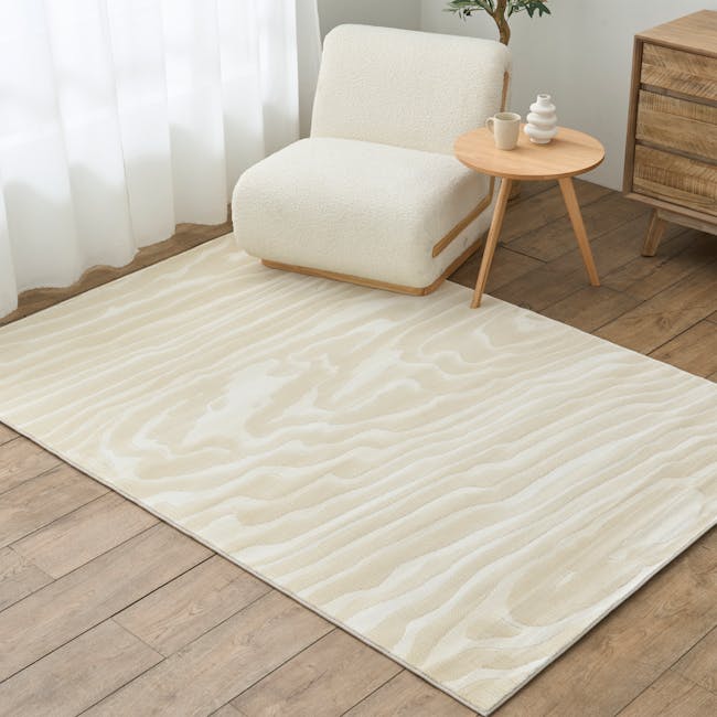 Alana Low Pile Rug - Ripple (2 Sizes) - 2 - Cream-colored, wavy-patterned area rug, light wooden floor, cozy living room