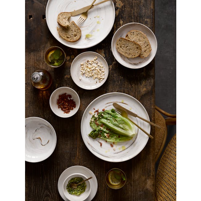 Luzerne Marble Bowl (3 Sizes) - 2 - Bread slices on white plates, olive oil in a glass bottle, bacon pieces in a bowl, green