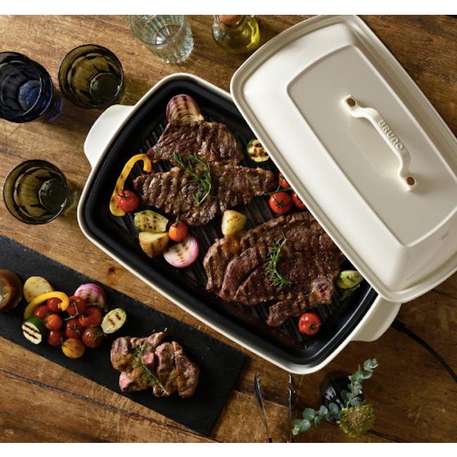 BRUNO Grande Grill Plate Attachment - 2 - Grilled steak, charred meat, roasted vegetables, colorful salad, wooden table