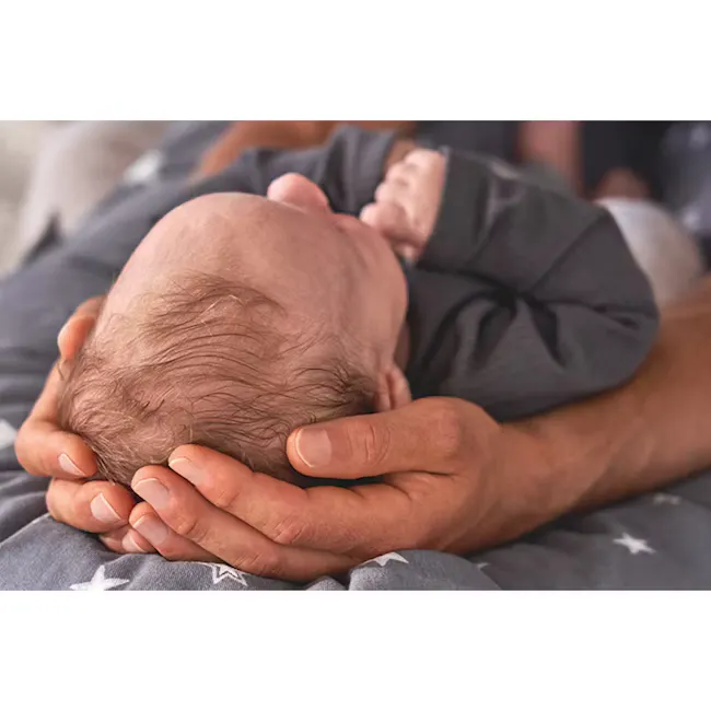 Theraline The Original Maternity and Nursing Pillow - Cream Fine Knit - 13 - Newborn baby cradled in loving hands, gray
