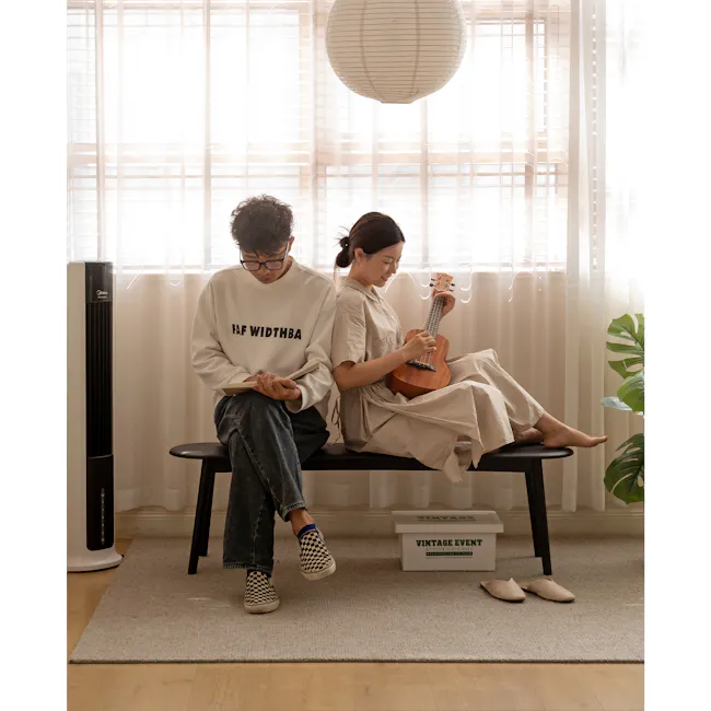 Felda Bench 1.4m - Black Ash - 6 - Sitting side by side, reading and playing the ukulele, wearing casual clothing, sitting
