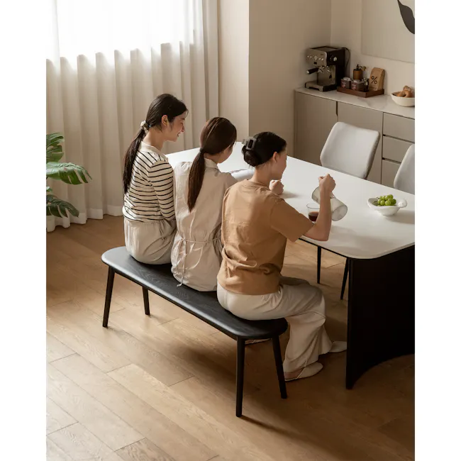 Felda Bench 1.4m - Black Ash - 2 - Modern kitchen, cozy atmosphere, three women, sitting on bench, natural light, white