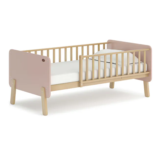 Natty Boori Bedside Bed - Cherry & Almond - 1 - Wooden crib with soft pink headboard and light wooden legs, minimalist