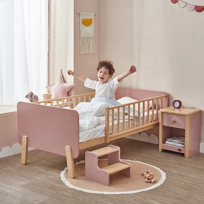 Natty Boori Bedside Bed - Cherry & Almond - 3 - Soft pastel pink and white bedding, cozy crib with wooden frame, child