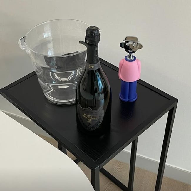 Fraser Side Table - 11 - Clear glass pitcher, black bottle of champagne, pink and blue figurine, modern black table