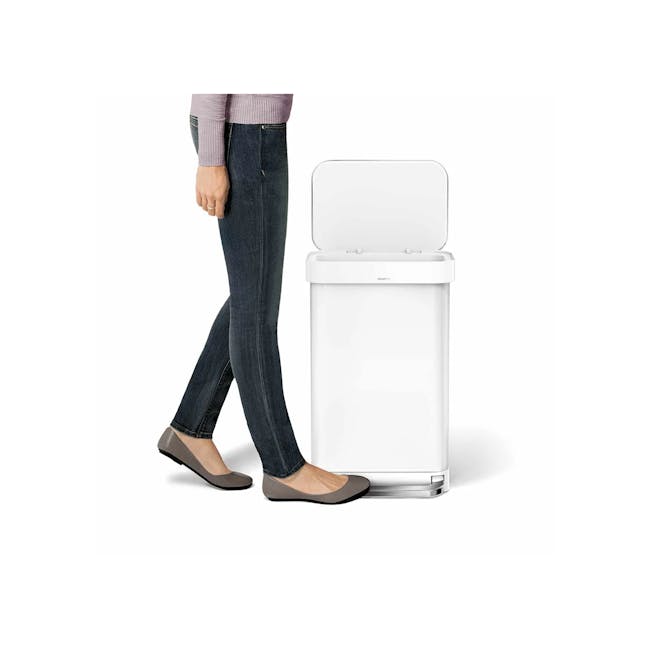 simplehuman Rectangular Step Can - White (2 Choices) - 7 - woman wearing jeans and flats, standing next to washing machine