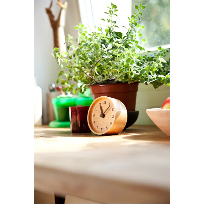 MUKU Table Clock - Beech - 3 - Wooden clock, potted plant, green leaves, sunlight, natural light, indoor setting, wooden